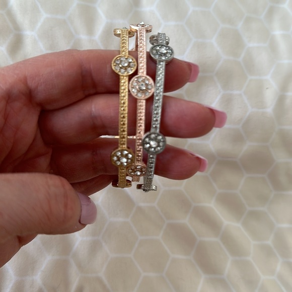 Tri-gold bracelets~ one gold one rose gold and one silver….